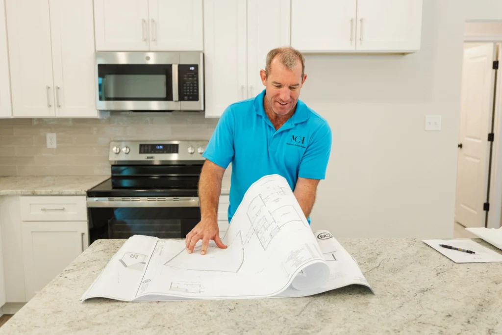 Josh McMahon Reviewing Home Blueprints
